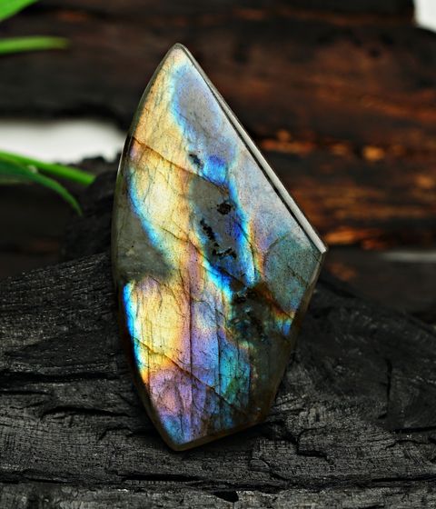 Teal labradorite gemstone displaying iridescent color