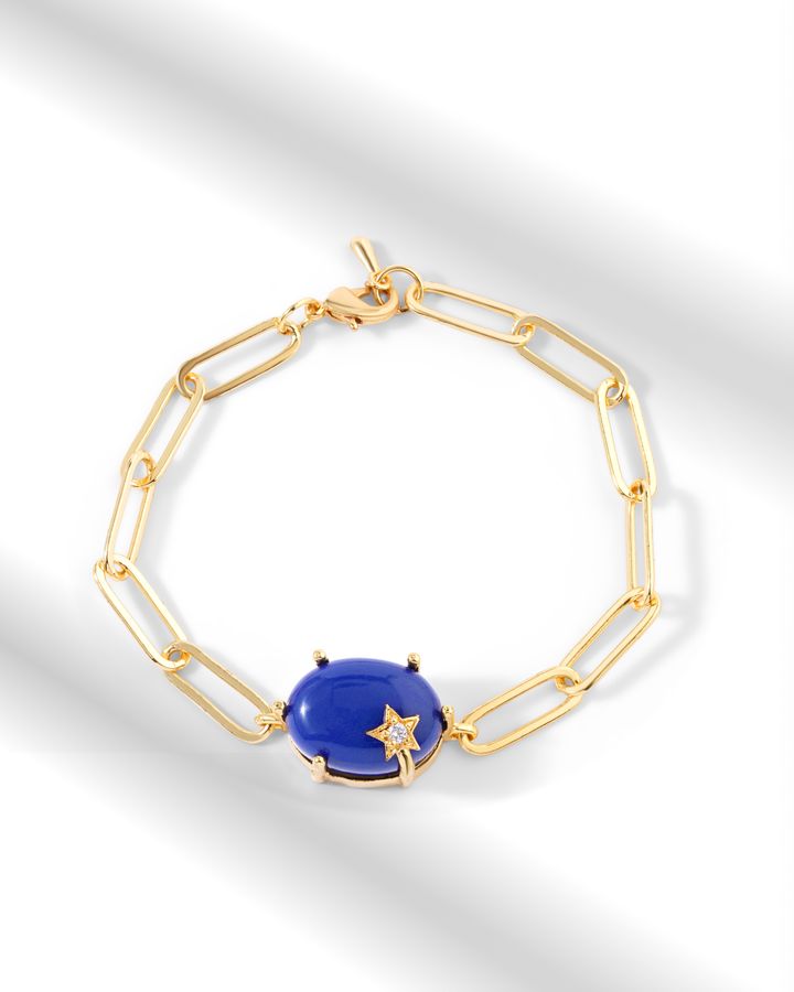 Gold bracelet with a vivid blue gemstone detail